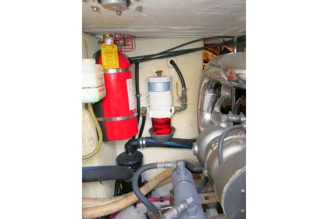 Slide: The Image of Engine room of 2003 Thunderbird Formula 40PC with fire extinguisher and mechanical components. - 51