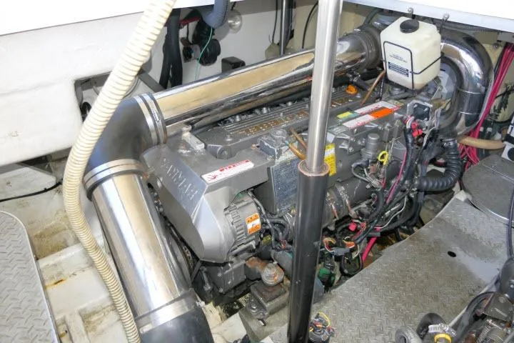 Slide: The Image of Engine compartment of a 2003 Thunderbird Formula 40PC boat, showcasing mechanical components. - 53