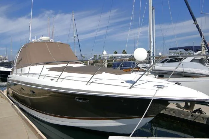 Slide: The Image of 2003 Thunderbird Formula 40PC yacht docked at marina under clear blue sky. - 58