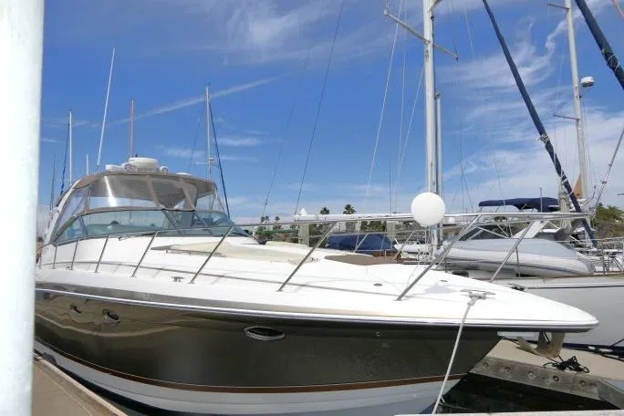 Slide: The Image of 2003 Thunderbird Formula 40PC yacht docked at marina under clear blue sky. - 59