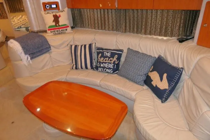 Slide: The Image of Luxurious 2003 Thunderbird Formula 40PC yacht interior with cozy seating and nautical-themed pillows. - 6