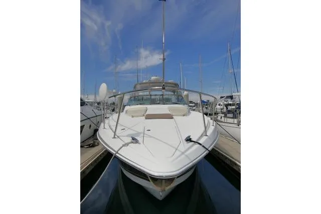 Slide: The Image of 2003 Thunderbird Formula 40PC yacht docked at marina under clear blue sky. - 60
