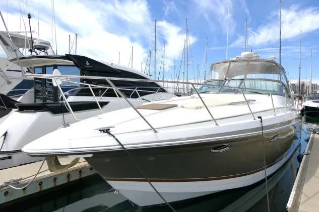 Slide: The Image of 2003 Thunderbird Formula 40PC yacht docked at marina under blue sky. - 62