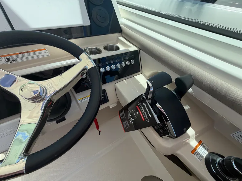 Slide: The Image of Helm of a Boston Whaler 330 Vantage with steering wheel and throttle controls. - 22