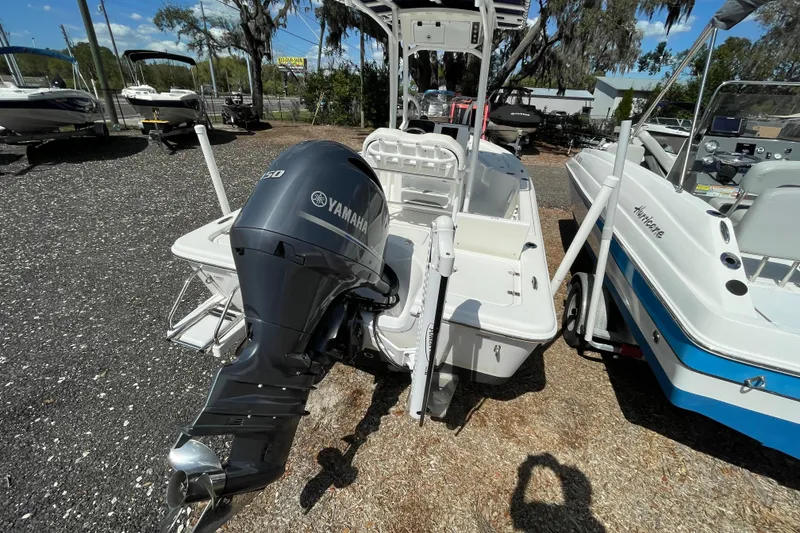 Slide: The Image of 2023 Sea Pro 208 Bay boat with Yamaha outboard motor, parked outdoors. - 3