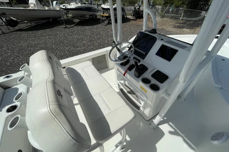 Slide: The Image of 2023 Sea Pro 208 Bay boat interior with steering console and seating. - 5