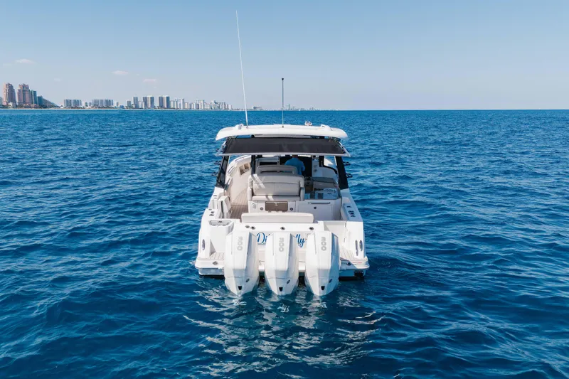 Slide: The Image of Boston Whaler 350 Realm 2021 with triple Mercury engines on open sea. - 10