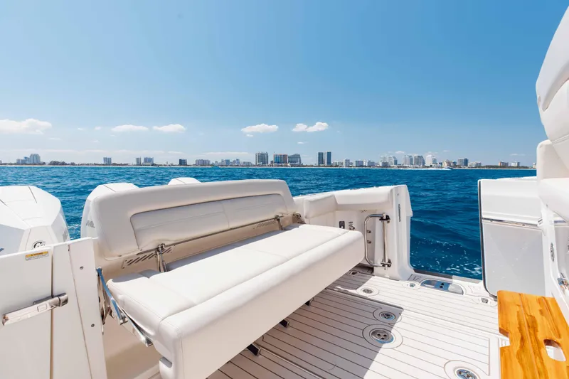 Slide: The Image of 2021 Boston Whaler 350 Realm boat interior with luxurious seating and ocean view. - 12