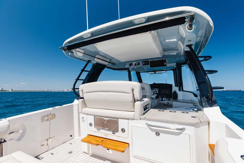 Slide: The Image of Boston Whaler 350 Realm 2021 boat deck with Mercury engines, ocean view. - 14