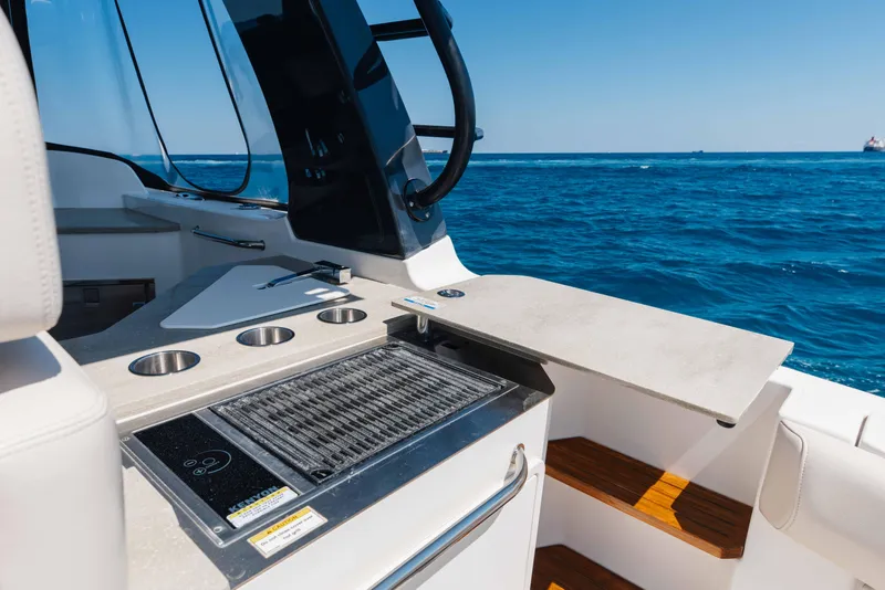 Slide: The Image of Boston Whaler 350 Realm 2021 boat interior with ocean view and clear blue sky. - 16