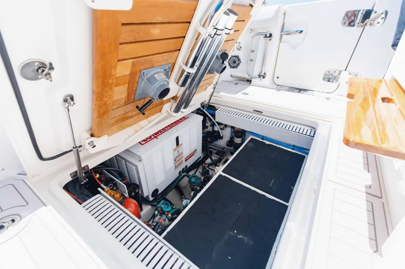 Slide: The Image of 2021 Boston Whaler 350 Realm boat interior with ocean view and clear blue sky. - 18