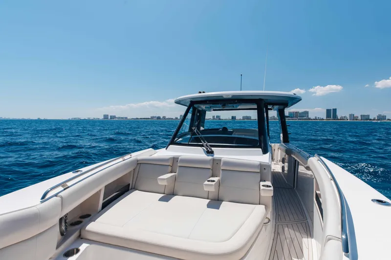 Slide: The Image of 2021 Boston Whaler 350 Realm helm with modern controls and ocean view. - 20