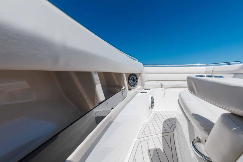 Slide: The Image of 2021 Boston Whaler 350 Realm interior with control panel and audio speakers. - 22