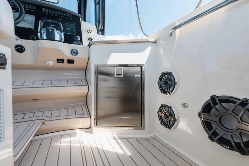 Slide: The Image of Interior of 2021 Boston Whaler 350 Realm boat with luxurious seating and ocean view. - 25