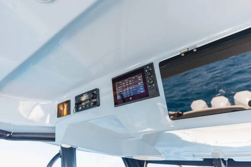 Slide: The Image of Luxury seating on a 2021 Boston Whaler 350 Realm boat with ocean view. - 26