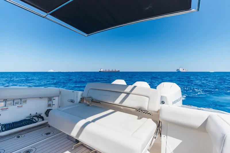 Slide: The Image of Interior cabin of 2021 Boston Whaler 350 Realm with plush seating and wooden accents. - 30