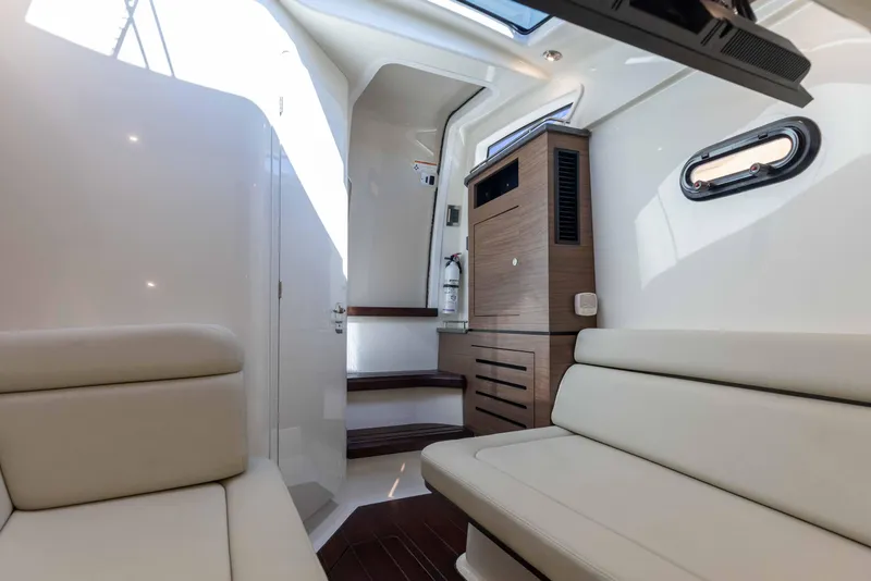 Slide: The Image of Aerial view of 2021 Boston Whaler 350 Realm cruising on open blue ocean. - 34