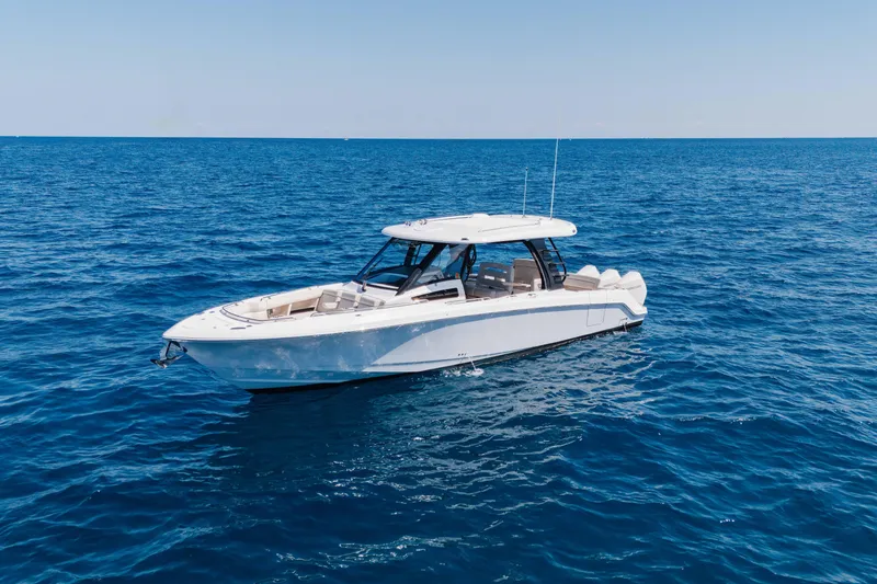 Slide: The Image of 2021 Boston Whaler 350 Realm boat on open blue ocean. - 4