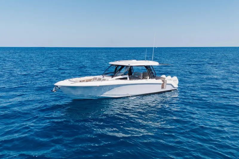 Slide: The Image of 2021 Boston Whaler 350 Realm boat on open blue sea. - 5