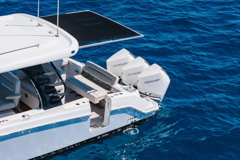 Slide: The Image of Boston Whaler 350 Realm 2021 boat with city skyline and ocean view. - 8