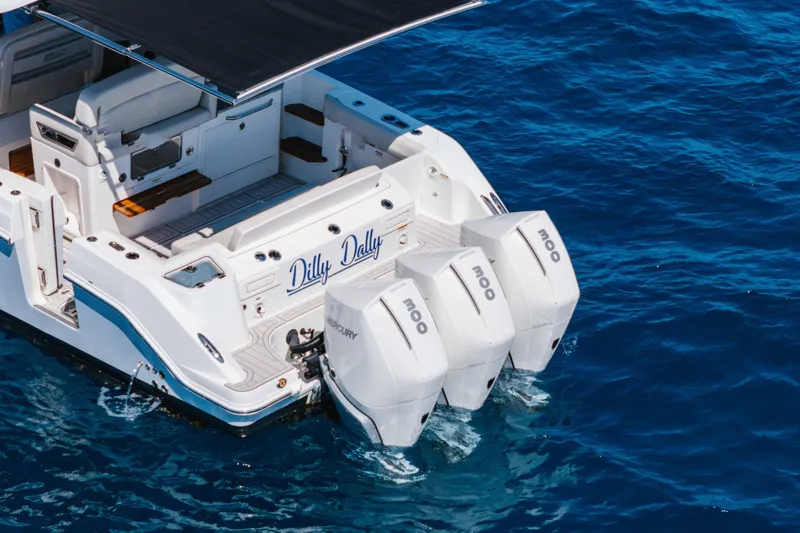 Slide: The Image of 2021 Boston Whaler 350 Realm boat with city skyline view, featuring luxurious seating. - 9