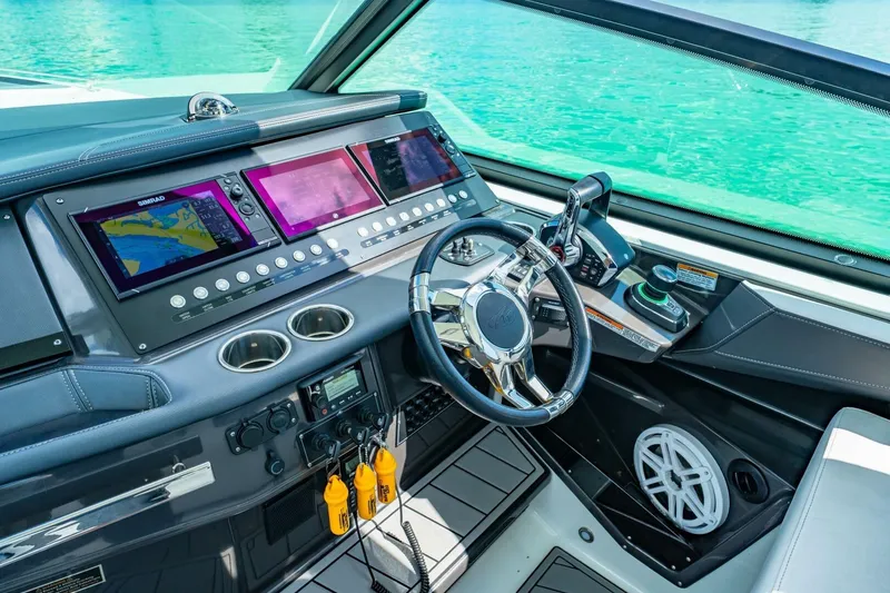 Slide: The Image of Cockpit of 2023 Monterey 350 Sport Yacht with advanced navigation systems and controls. - 16