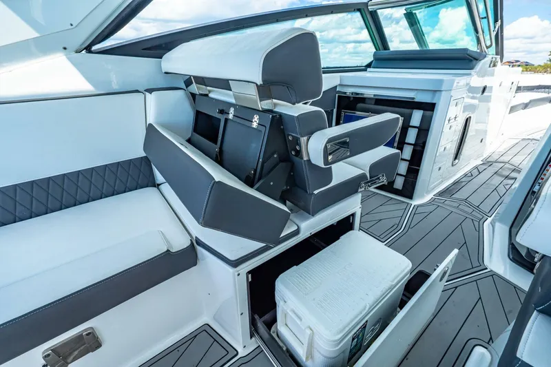 Slide: The Image of 2023 Monterey 350 Sport Yacht interior with seating and storage compartments. - 19