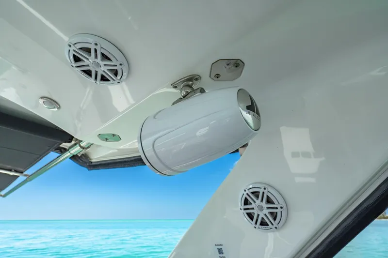 Slide: The Image of 2023 Monterey 350 Sport Yacht speakers and camera, ocean backdrop. - 21