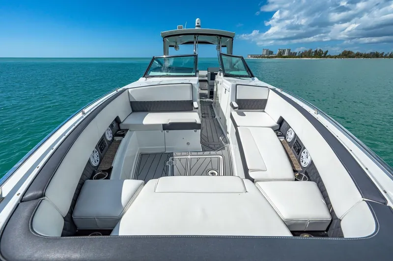 Slide: The Image of 2023 Monterey 350 Sport Yacht interior with luxurious seating on open water. - 25
