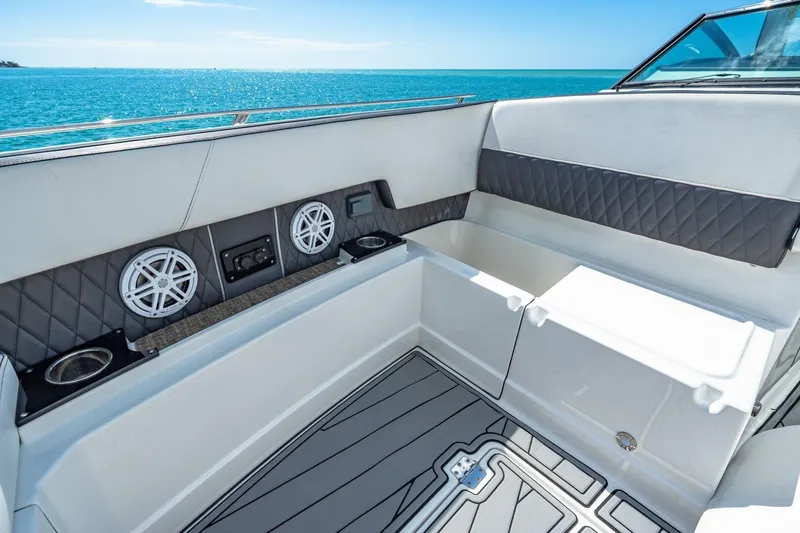 Slide: The Image of 2023 Monterey 350 Sport Yacht interior with speakers, cup holders, and ocean view. - 27