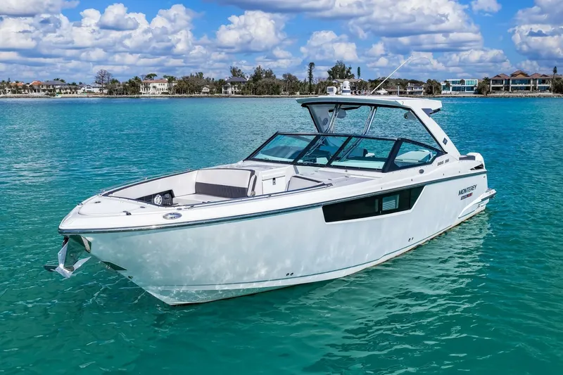 Slide: The Image of 2023 Monterey 350 Sport Yacht on clear turquoise water under a partly cloudy sky. - 35