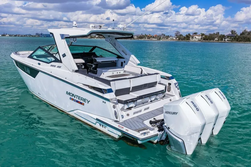 Slide: The Image of 2023 Monterey 350 Sport Yacht on turquoise water with triple Mercury engines. - 39