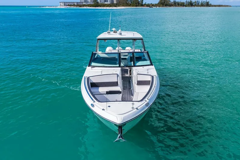 Slide: The Image of 2023 Monterey 350 Sport Yacht cruising on turquoise waters, showcasing sleek design and luxury. - 48