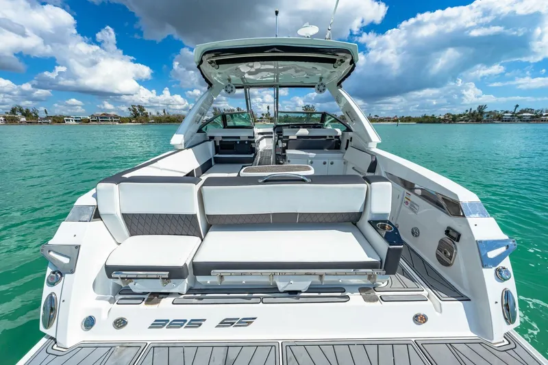 Slide: The Image of 2023 Monterey 350 Sport Yacht on turquoise water, showcasing luxurious seating and sleek design. - 5