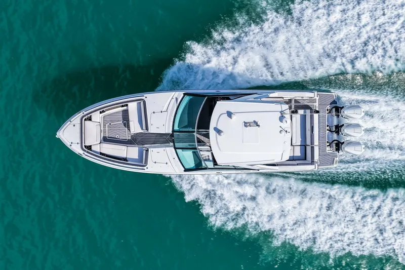 Slide: The Image of Aerial view of 2023 Monterey 350 Sport Yacht cruising on turquoise water. - 55