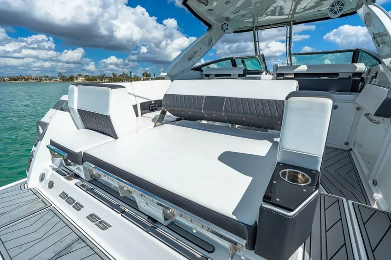 Slide: The Image of 2023 Monterey 350 Sport Yacht with luxurious seating on a sunny day. - 7