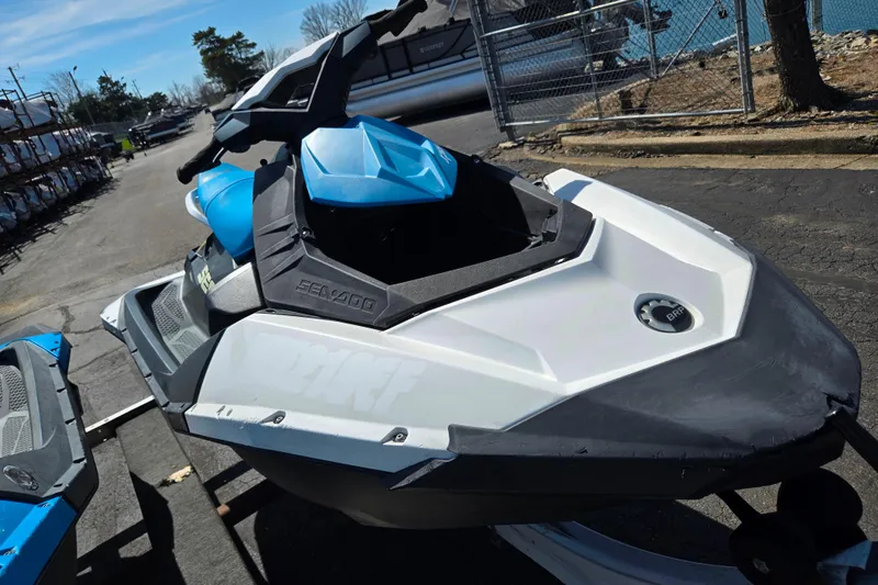 Slide: The Image of 2020 Sea-Doo Spark 2up jet ski in blue and white, parked outdoors. - 7