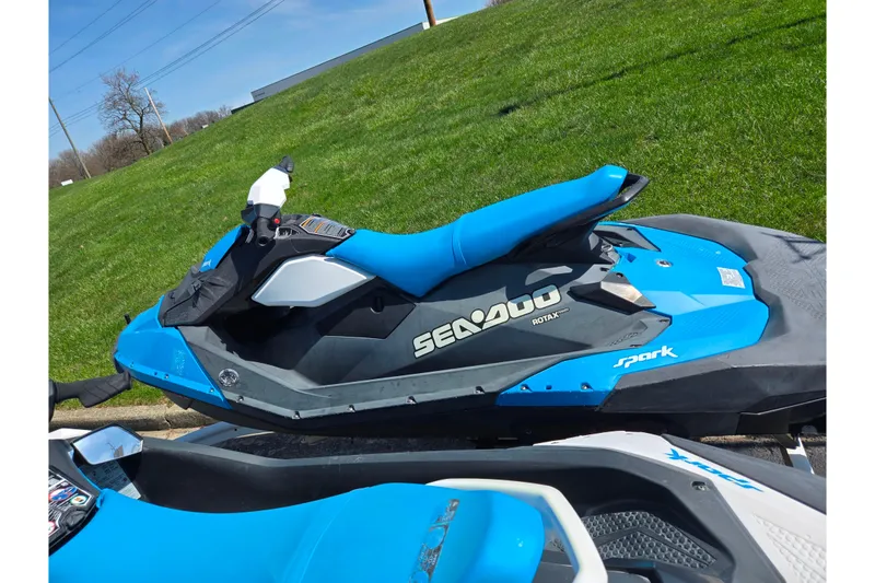 Slide: The Image of 2017 Sea-Doo Spark 2up jet ski in vibrant blue on grassy background. - 4
