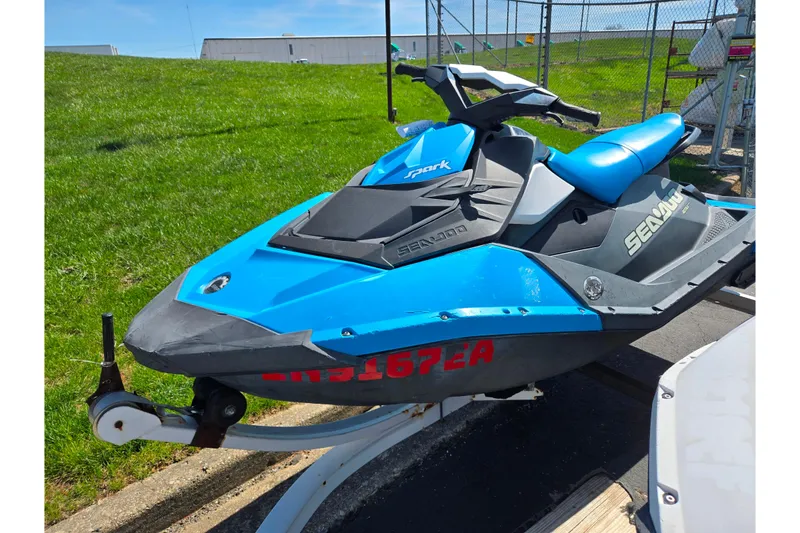Slide: The Image of 2017 Sea-Doo Spark 2up jet ski in blue on a trailer. - 5