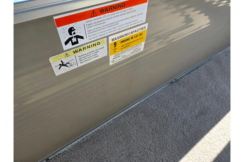 Slide: The Image of Warning labels on 2016 Lowe SS 190 boat, indicating safety and capacity information. - 14