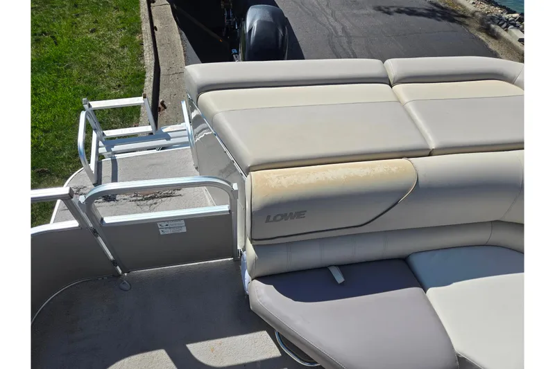 Slide: The Image of 2016 Lowe SS 190 boat with beige seating and rear entry ladder. - 15