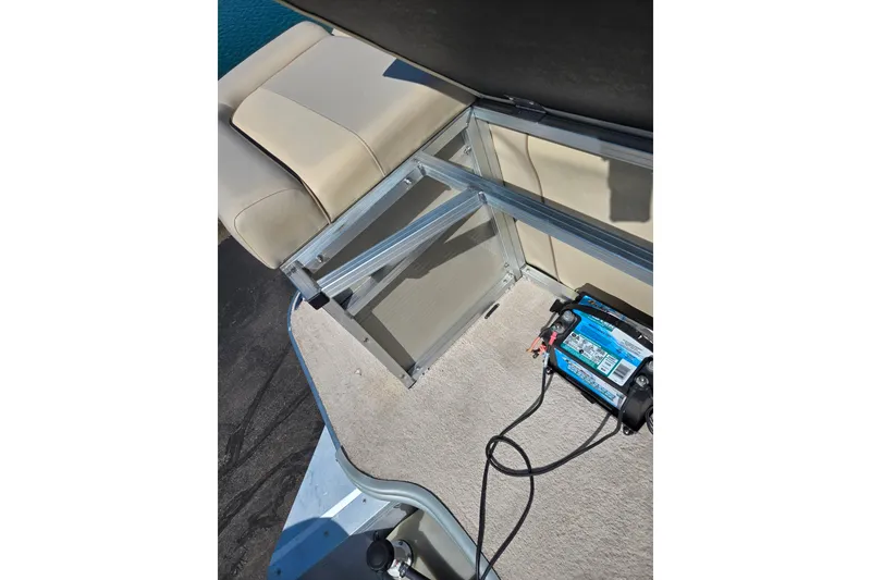 Slide: The Image of Interior view of a 2016 Lowe SS 190 boat showing seating and battery compartment. - 17
