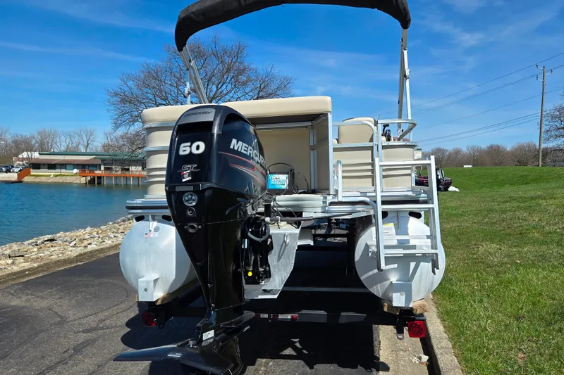 Slide: The Image of 2016 Lowe SS 190 pontoon boat with Mercury 60 HP engine by a lake. - 2