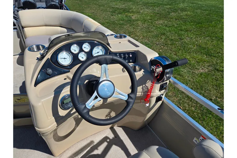 Slide: The Image of Steering console of a 2016 Lowe SS 190 boat with gauges and controls. - 21