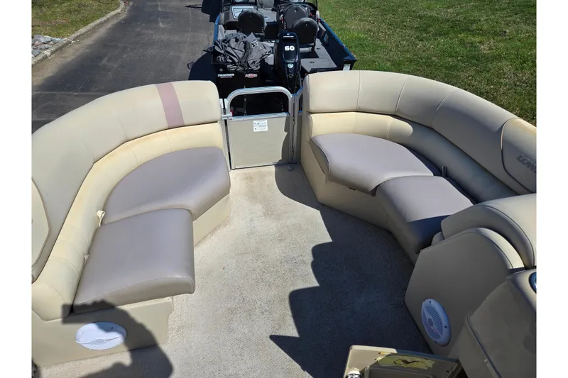 Slide: The Image of 2016 Lowe SS 190 boat interior with beige seating and open deck. - 23