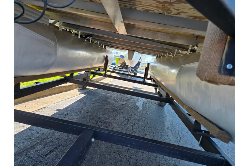 Slide: The Image of Underneath view of a 2016 Lowe SS 190 pontoon boat on a trailer. - 7