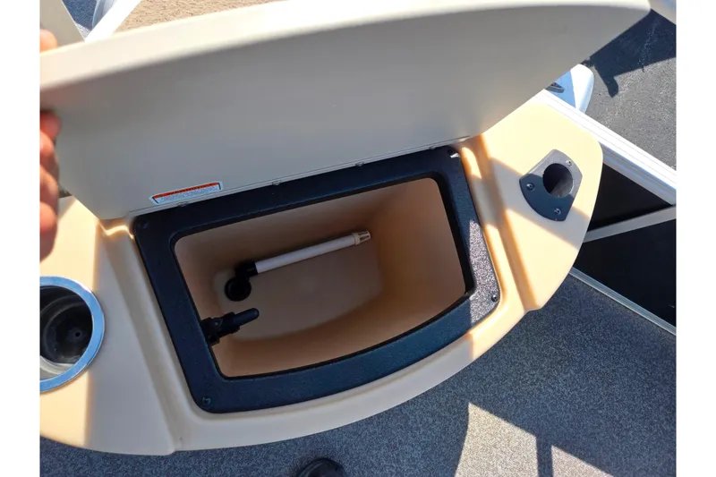 Slide: The Image of Open storage compartment on 2016 Sun Tracker Bass Buggy 18 DLX boat. - 19