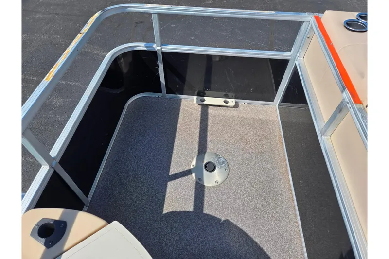 Slide: The Image of 2016 Sun Tracker Bass Buggy 18 DLX deck area with railing and seating. - 21