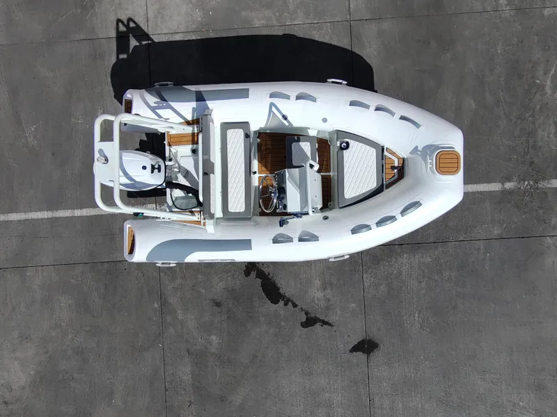 Slide: The Image of Aerial view of 2025 Tide Craft San Juan 11 boat on concrete surface. - 8
