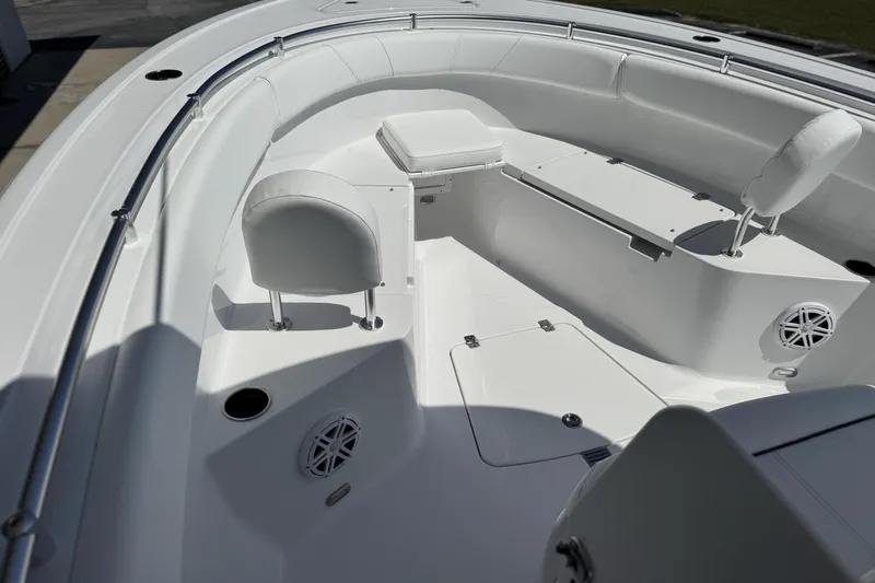 Slide: The Image of 2026 Sportsman Open 252 Center Console boat interior with seating and speakers. - 11